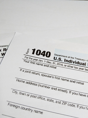 Stack of Close Up of USA Tax Form type 1040, Individual Income Tax Return