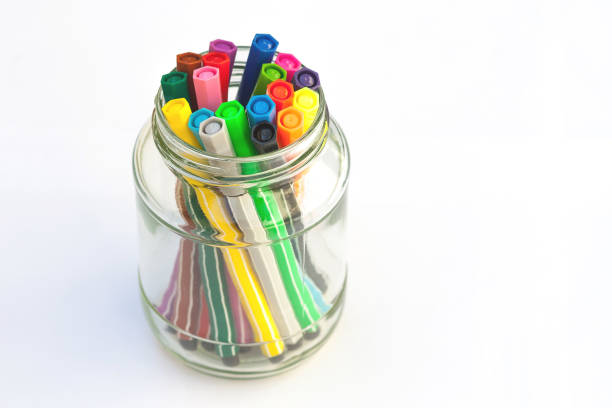 istock Various color pen in glass bottle isolated on white background. 861945928
