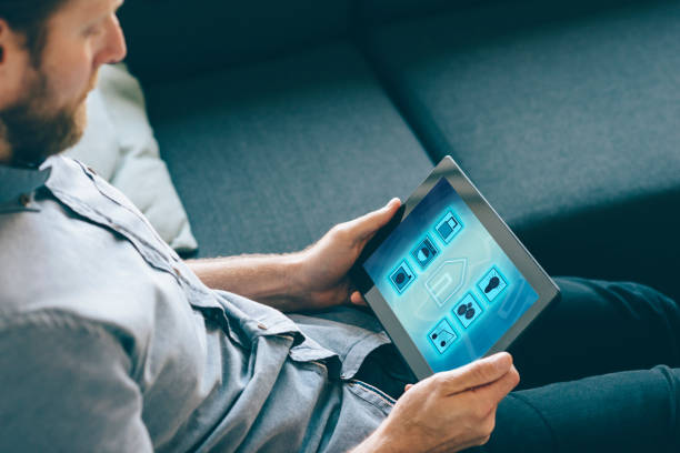 istock Internet of things controlled by app on digital tablet in living room 861946556