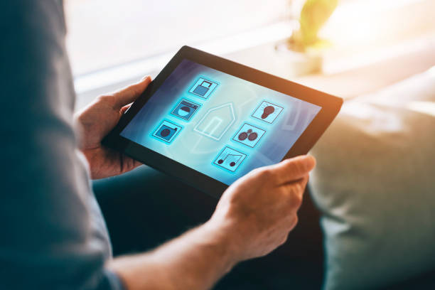 istock Internet of things integrated in app on digital tablet helps man control smart home 861946716