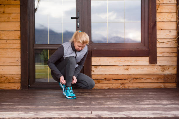 istock Sport runner woman tying laces before training. Marathon. 861954970