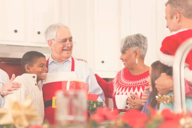 istock Multi-ethnic family in home kitchen at Christmas party. 861959998