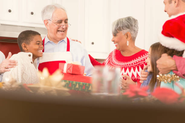 istock Multi-ethnic family in home kitchen at Christmas party. 861960126