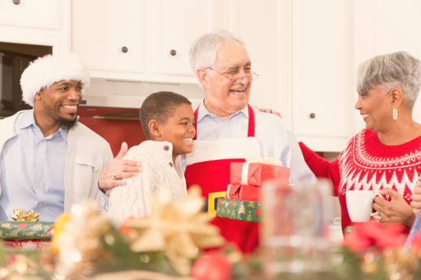 istock Multi-ethnic family in home kitchen at Christmas party. 861962470