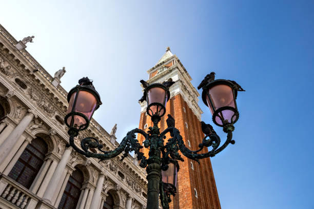 Lanterns with pigeons on Saint Mark's Square (Piazza San Marco) in Venice, Italy