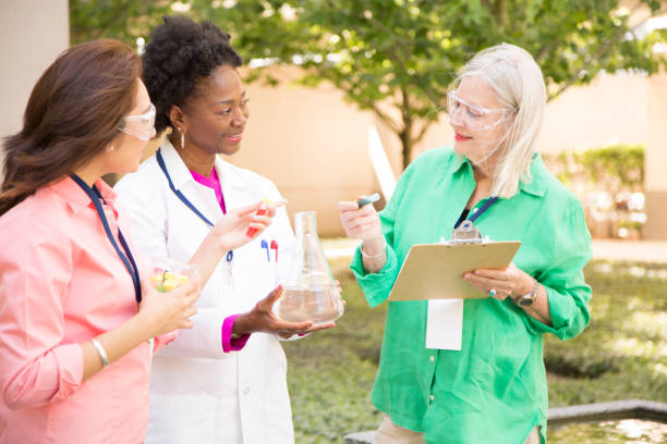 istock STEM themes with female scientists working on water project outdoors. 861966380