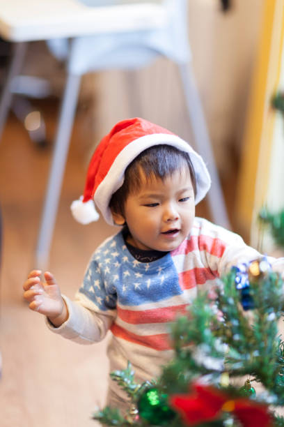 istock Japanese Child Decorating Christmas Tree 861966412