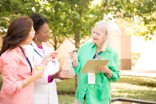 istock STEM themes with female scientists working on water project outdoors. 861966438