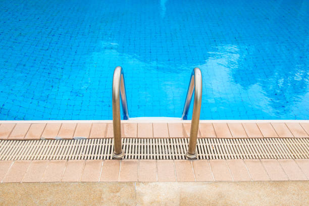 istock Swimming pool with stair at hotel. 861967182