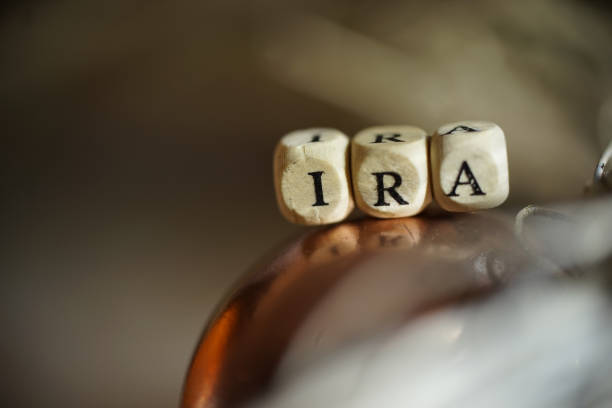 Ira shot of word retirement scrabble box gold in a roth ira stock pictures, royalty-free photos & images