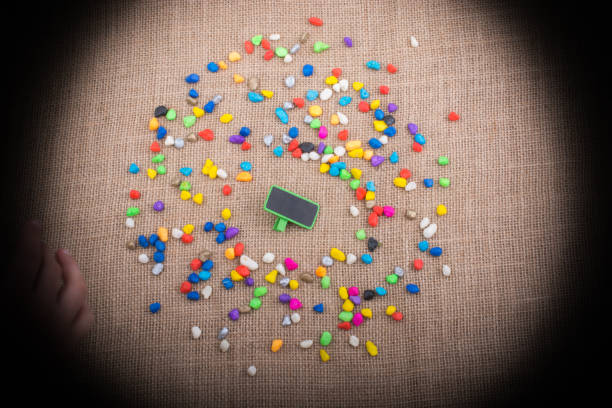 istock Little noticeboard amid Colorful pebbles 861971564