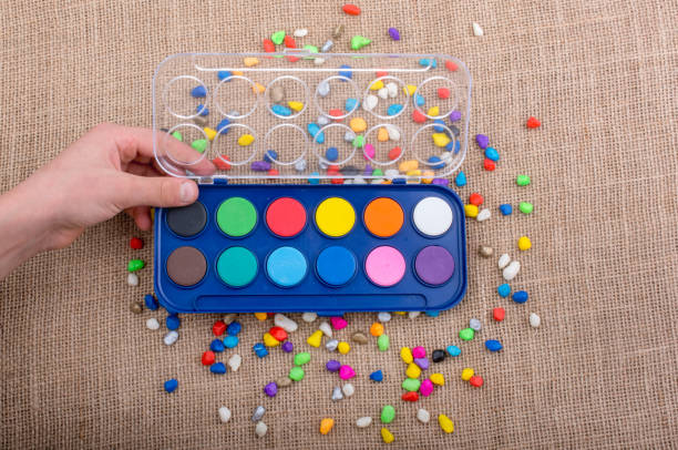 istock Water colors amid colorful pebbles 861971616