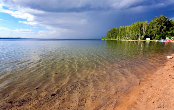 dark storm clouds before rain above the lake