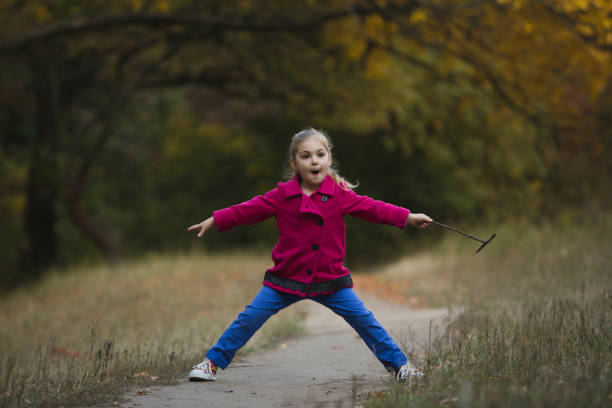 istock Little girl blocking hiking trail in forest 861975698