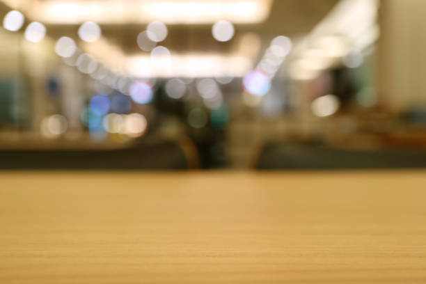 istock Closed up modern style wooden table, selective focus with abstract blurred room interior in background 861983072