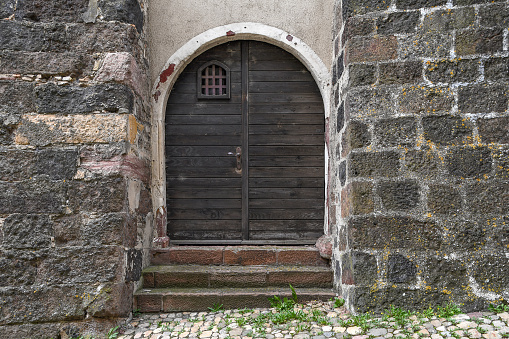 old wooden double door of medieval castle in Germany