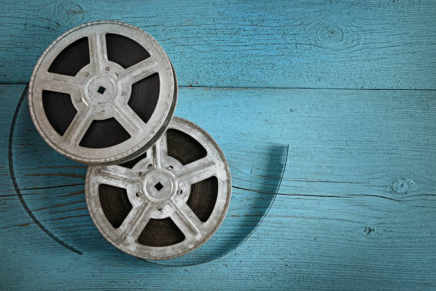 istock Old film strip on wooden blue background. 862010344