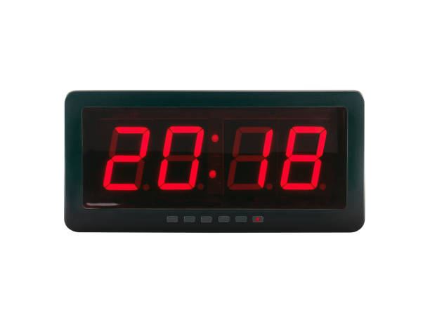 istock closeup red led light illumination numbers 2018 on black digital electric alarm clock face isolated on white background 862026260