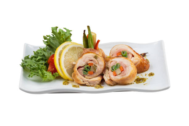istock Stir fried chicken wrap with carrot. scallion and radish served with sliced lemon, tomato and lettuce in white ceramic plate. 862029270