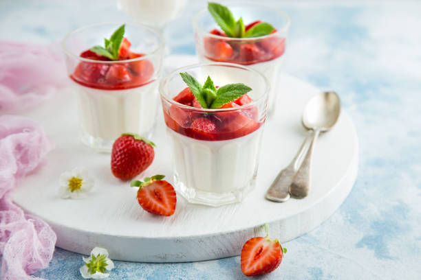 istock vanilla cream cheese and strawberry dessert on glasse 862029930