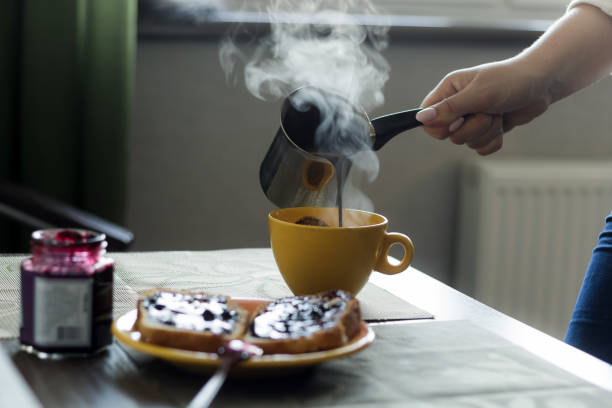 istock woman pours hot coffee from cezve 862034328