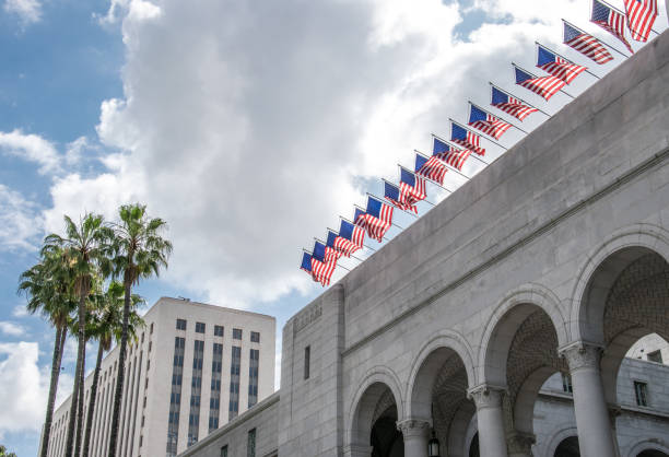 Picturesque streets of Los Angeles. Patriotic national flags of the USA on the facades of public buildings