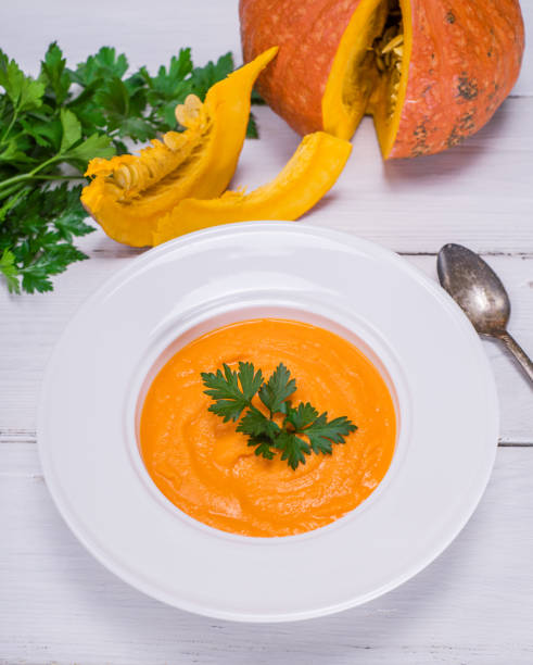 istock cream pumpkin soup in a ceramic round plate 862044952