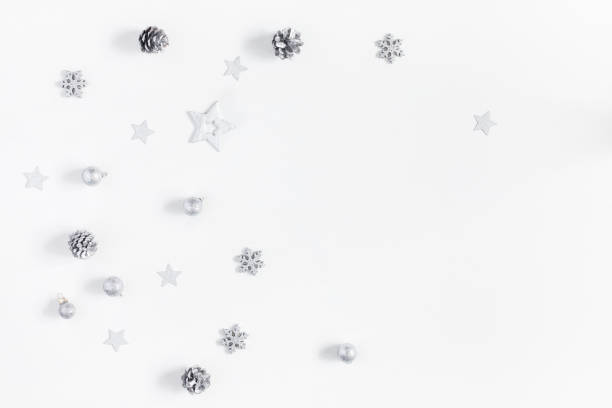 istock Christmas silver decorations on white background. Flat lay, top view 862045126