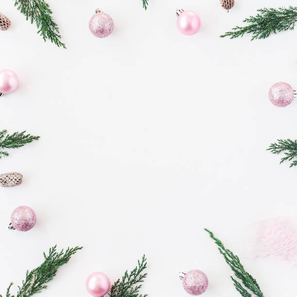istock Christmas frame made of pink decorations. Flat lay, top view 862045250