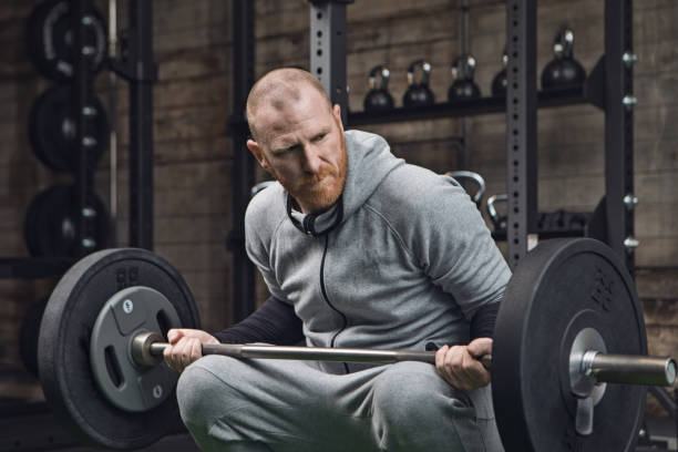 istock Middle Aged Redhead Handsome Man working out in Gym Setting 862049064