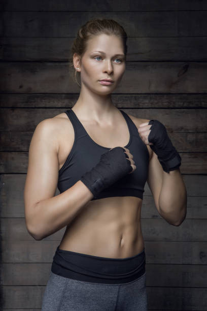 istock Beautiful Young Female Athlete posing in Gym Setting 862051616