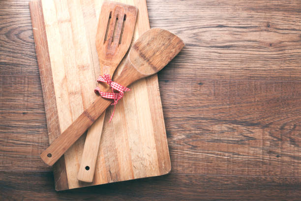 istock wooden dish ,fork and spoon white red tablecloth on wooden background 862058524
