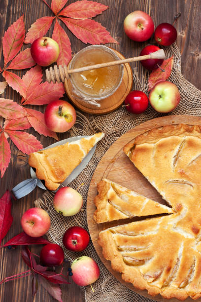 istock Fresh slice of apple pie with whole pie on  background 862061178
