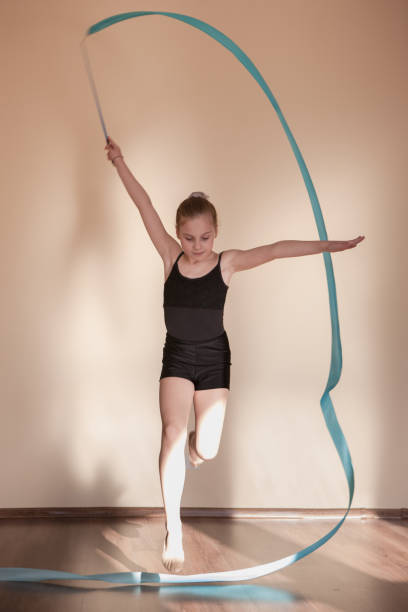 istock Rhythmic gymnastics. Graceful girl in motion 862065436