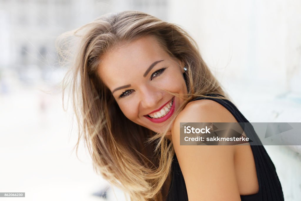 Happy young carefree woman smiling outdoor portrait Happy young brunette carefree woman smiling outdoor portrait, happiness Fashion Model Stock Photo