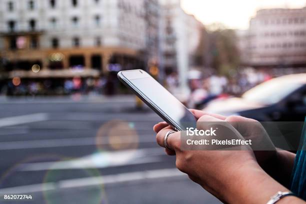 Woman Using Smartphone Stock Photo - Download Image Now - On The Move, Mobile Phone, City
