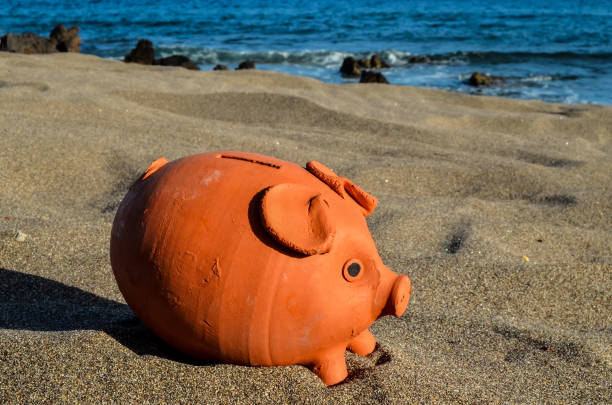 istock Piggy Bank on the Sand Beach 862073458