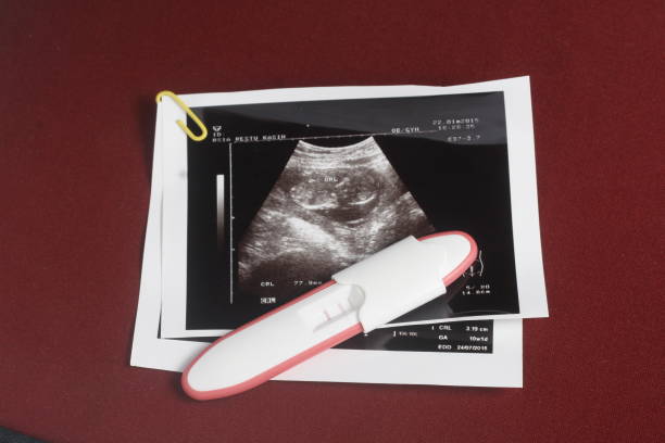 istock Close Up, Pregnancy Test Pack, Positive Result At Dark Red Background 862073660
