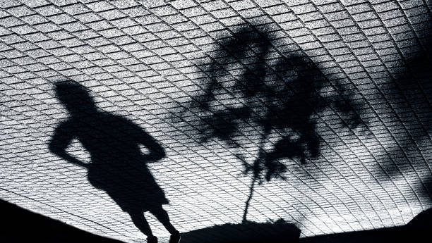 istock Shadow of a woman and a small tree 862076004