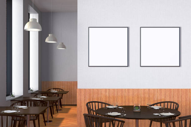 istock Modern restaurant interior with served tables and blank poster 862076028