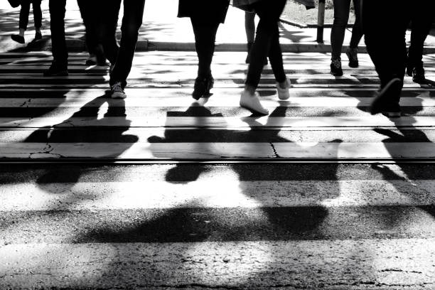istock Blurry zebra crossing with  pedestrians walking shadows 862076480