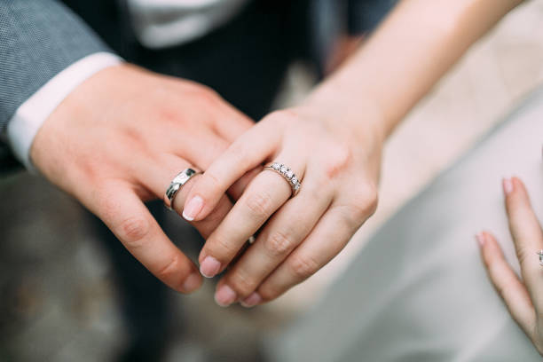 istock Just married young couple showing up their rings. Artwork. Soft focus 862076958