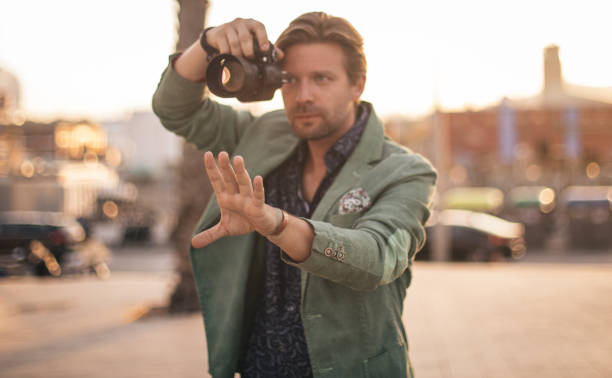 istock Handsome photographer taking pictures 862083138