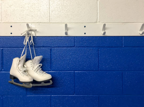 istock Figure skates hanging on locker room 862083352
