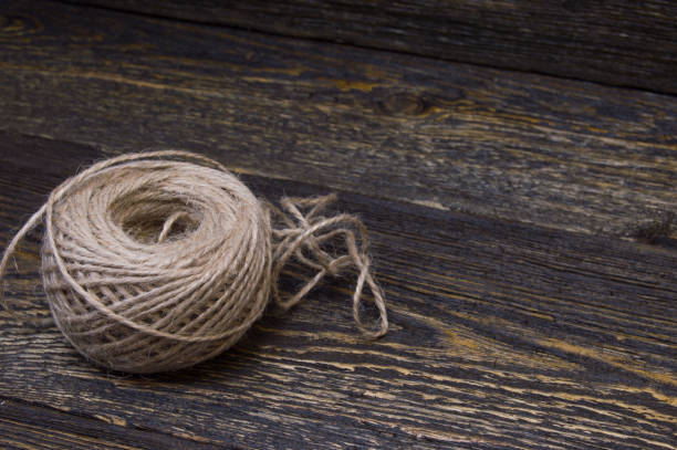Grunge jute twine on rustic wooden background