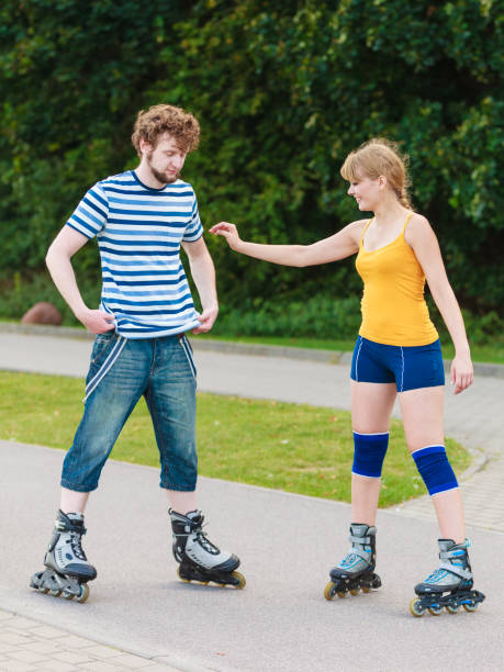 istock Young couple on roller skates riding outdoors 862090368