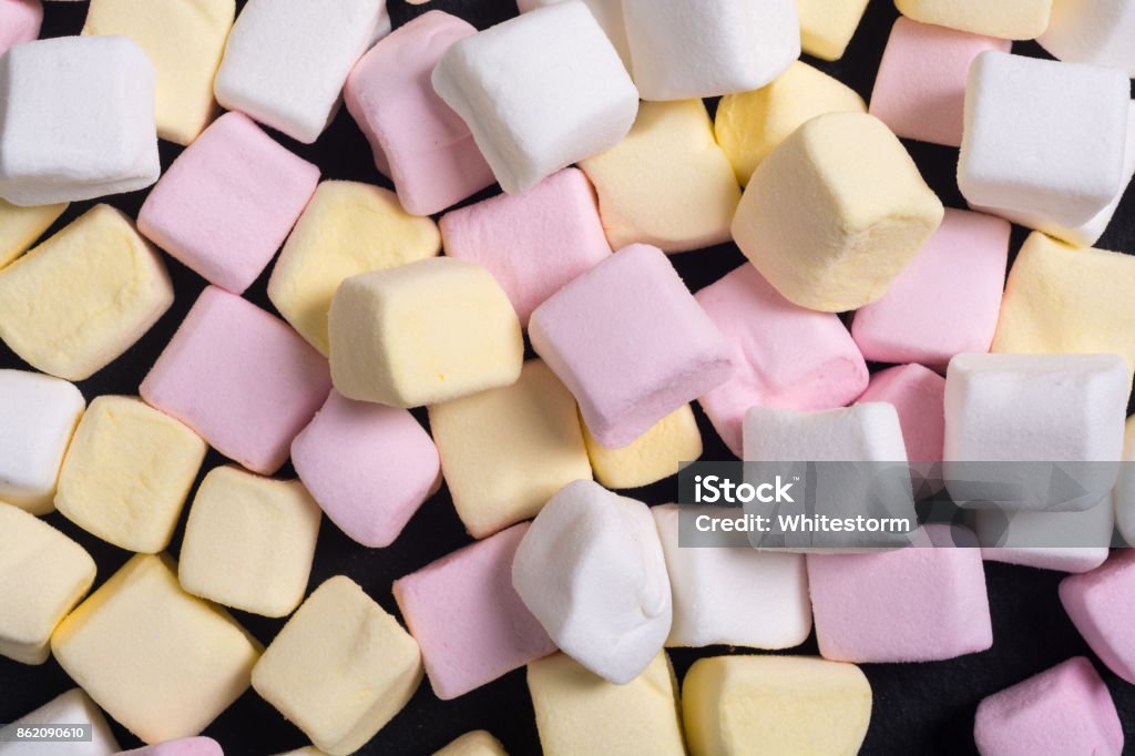 Colorful marshmallow skewers Colorful marshmallow background . White , pink and yellow Blue Stock Photo