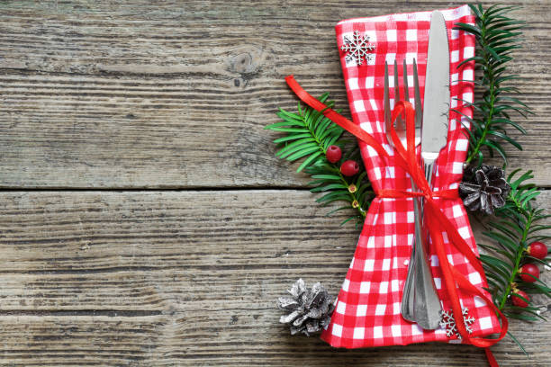 istock Christmas table place setting with christmas pine branches,ribbon, dried oranges and cones 862093830