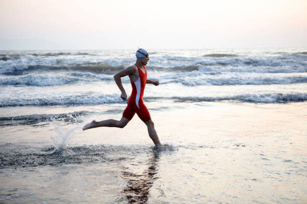 istock Youn Man Running At Beach 862097174