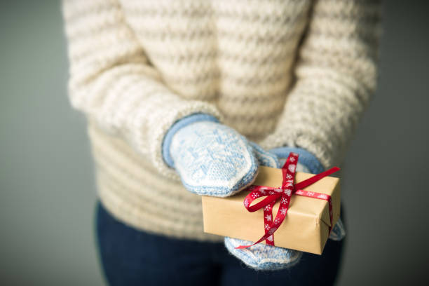 istock A girl holding a box with a Christmas present 862098094